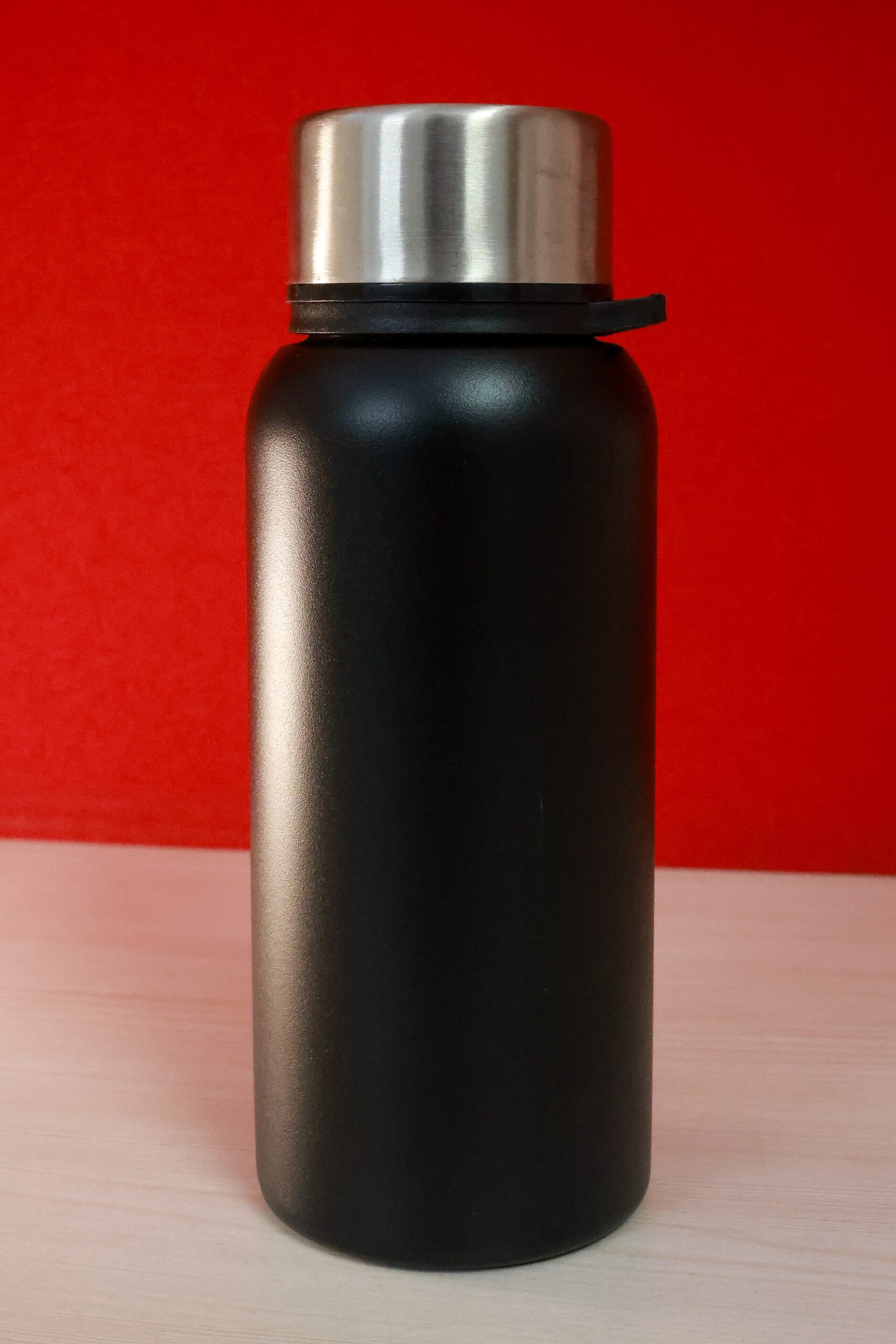 A matte black insulated steel bottle