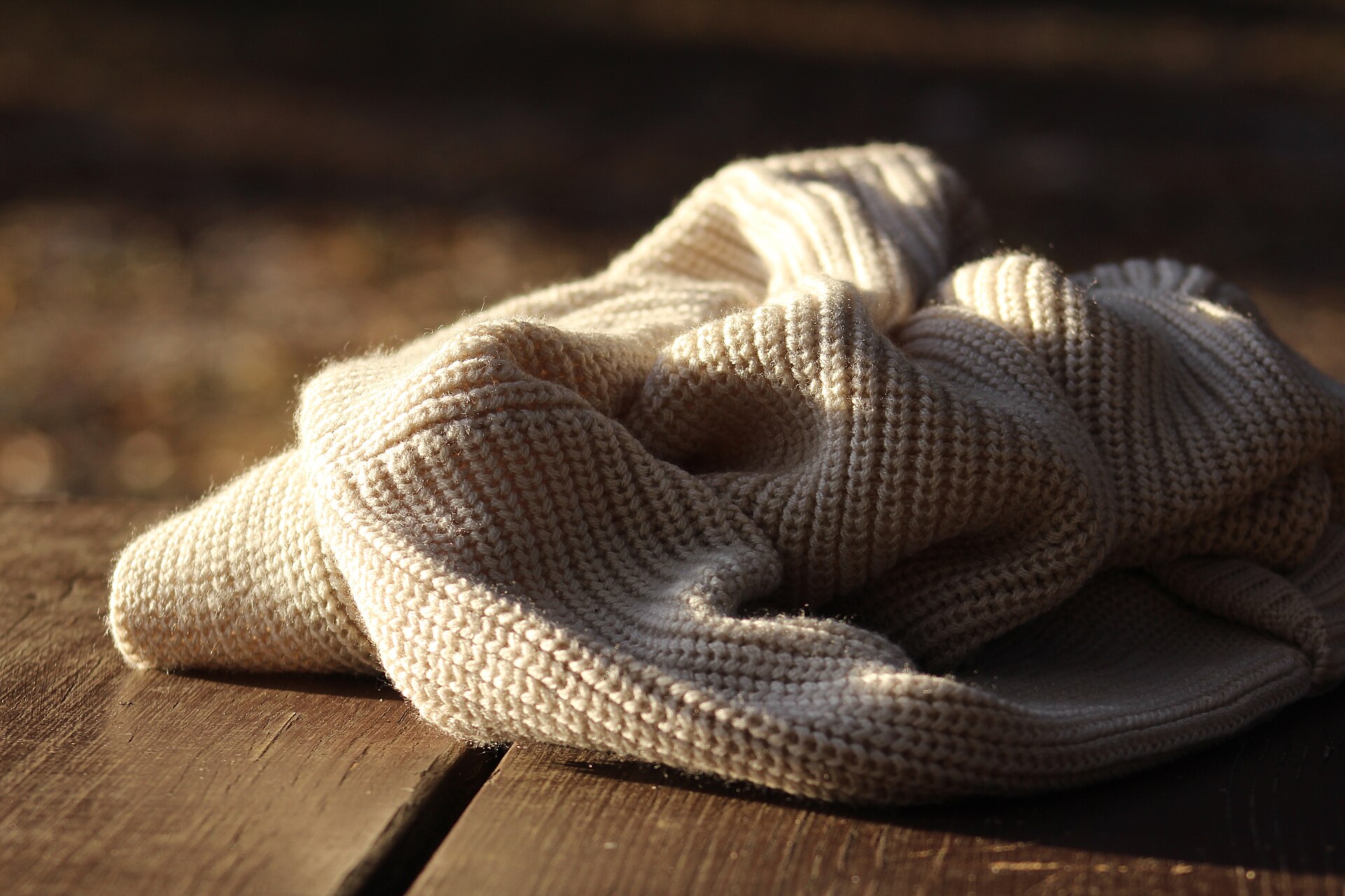 A folded cream waffle-knit crew jumper