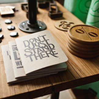 Kraft-cover pocket notebooks on a workbench